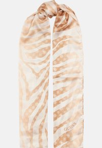 Foulard di seta con un motivo a strisce zebrate beige e bianche, con accenti del logo sparsi e un'etichetta di marca all'estremità.