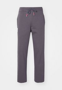 Graue Sweatpants aus weichem Stoff mit elastischem Bund und Kordelzug, Seitentaschen und geradem Beinschnitt.