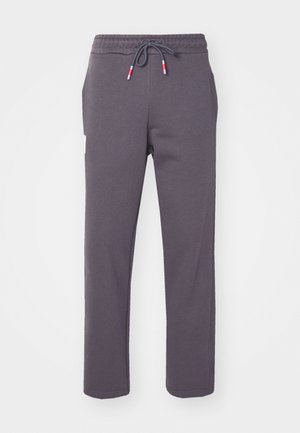 Pantaloni tuta grigi realizzati in morbido tessuto, con vita elastica e cordoncino, tasche laterali e design a gamba dritta.