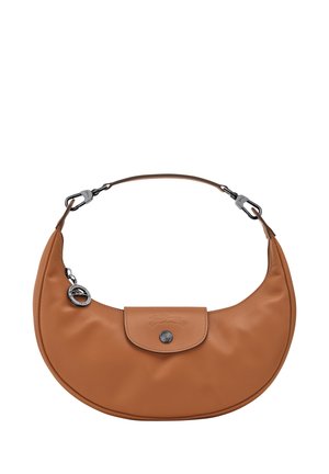 Brown leather handbag with a curved shape, detachable strap, silver-tone hardware, and a front flap with a snap button closure.