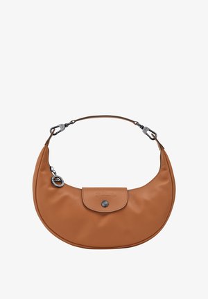 Brown leather handbag with a curved shape, detachable strap, silver-tone hardware, and a front flap with a snap button closure.