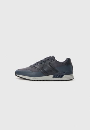 Men's athletic shoe in dark navy with mesh and synthetic upper. Features lace-up design, padded collar, and rubber sole with textured grip.