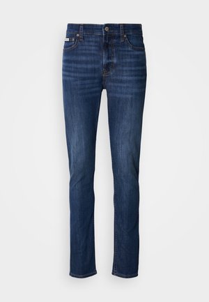 Dunkelblaue Jeans aus Denim mit geradem Schnitt, ausgestattet mit fünf Taschen, einem Knopfverschluss und sichtbaren Nähten entlang der Nähte.