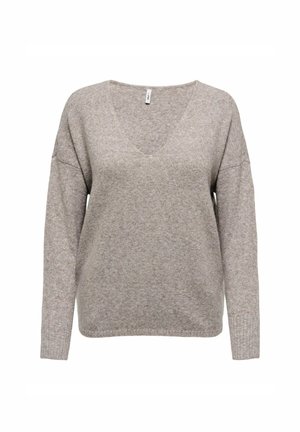 Sweter w serek w jasnym beżu, z długimi rękawami, luźnym krojem i miękką teksturą z delikatnym wzorem drobnych plamek.