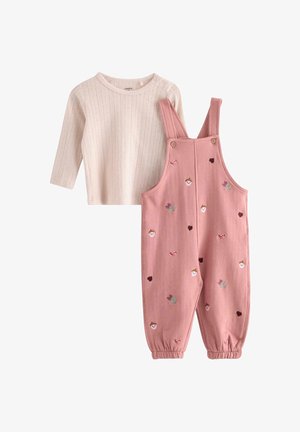 Flødefarvet ribbet langærmet skjorte med lyserøde overalls med broderede ansigter, hjerter, blomster og elastiske manchetter til en småbarn.
