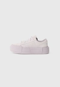 Light purple platform sneakers made of suede, featuring round toe, lace-up design, and textured side panels. Flat rubber sole, low profile.