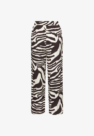 Weit geschnittene Hose mit schwarz-weißem Zebramuster und elastischem Bund vor weißem Hintergrund.