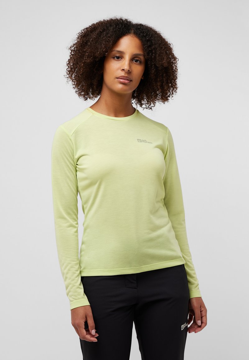 Hellegrünes Langarmshirt aus weichem Material, mit rundem Halsausschnitt und Raglanärmeln. Dezentes Logo auf der Brust.