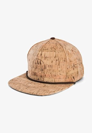 Cork baseball cap with a flat brim, featuring a brown trim and a black logo of mountains and trees embossed on the front.