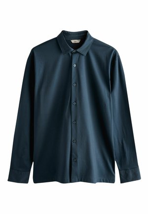 Tumši zilas krāsas garas piedurknes krekls ar pogām priekšpusē, klasiskā apkakle un gluds kokvilnas audums. Ar sešām pogām gar muguru.