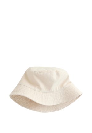 Beżowy bawełniany kapelusz typu bucket z szerokim, opadającym rondem i widocznym przeszyciem wokół korony i ronda.