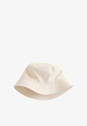 Bézs színű pamut vödörkalap széles, lefelé lejtő karimával és látható varrással a kalap tetején és karimáján.
