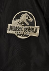 Molo JURASSIC WORLD HEATH UNISEX - Casaco de inverno - black