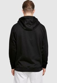 ABSOLUTE CULT STRANGER THINGS - FRIENDS DONT LIE HANDS   - Luvtröja - black