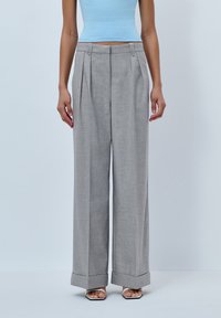 Gray wide-leg trousers with front pleats, cuffed hems, and a lightweight fabric. Features a flat front waistband with hidden fasteners.