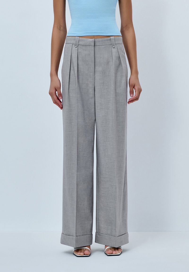 Gray wide-leg trousers with front pleats, cuffed hems, and a lightweight fabric. Features a flat front waistband with hidden fasteners.