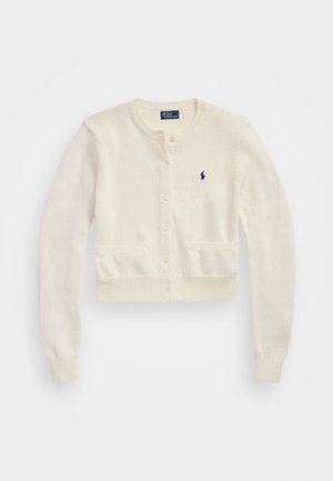 Cropped, ivory cardigan with a knitted texture, featuring a round neck, button closure, two front pockets, and a small navy logo on the chest.