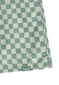 Tessuto a scacchi in verde e crema con una texture liscia. Include un'etichetta blu con il testo "Pockies" e dettagli all'orlo.