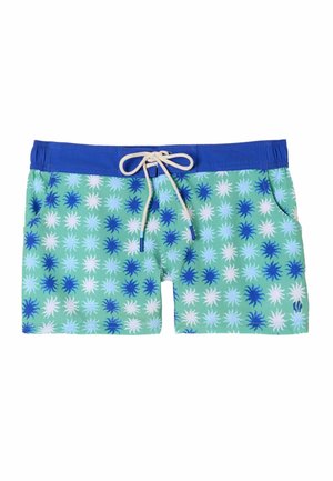 Grüne Badeshorts mit blauem Bund, weißem Kordelzug und blau-weißem Sonnenstrahlenmuster überall.