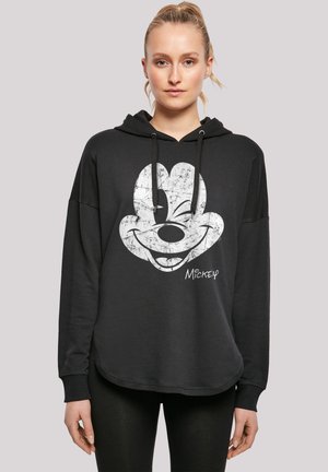 Black hoodie made of cotton blend, featuring a large white Mickey Mouse graphic on the front, with drawstring hood and relaxed fit.