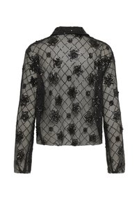 Jachetă din plasă neagră cu mâneci lungi, decorată cu aplicații de flori din mărgele. Culoare structurată și design scurt, cu un model în formă de diamant.