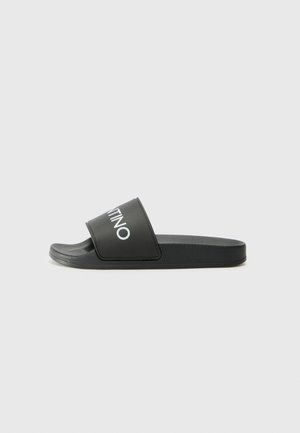 Black slide sandal with a wide strap featuring a white logo. Made from smooth, durable synthetic material. Flat sole with textured grip.