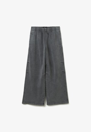 Grey wide-leg pants made from soft fabric, featuring an elastic waistband and subtle brand logo on the side. Smooth texture with no patterns.