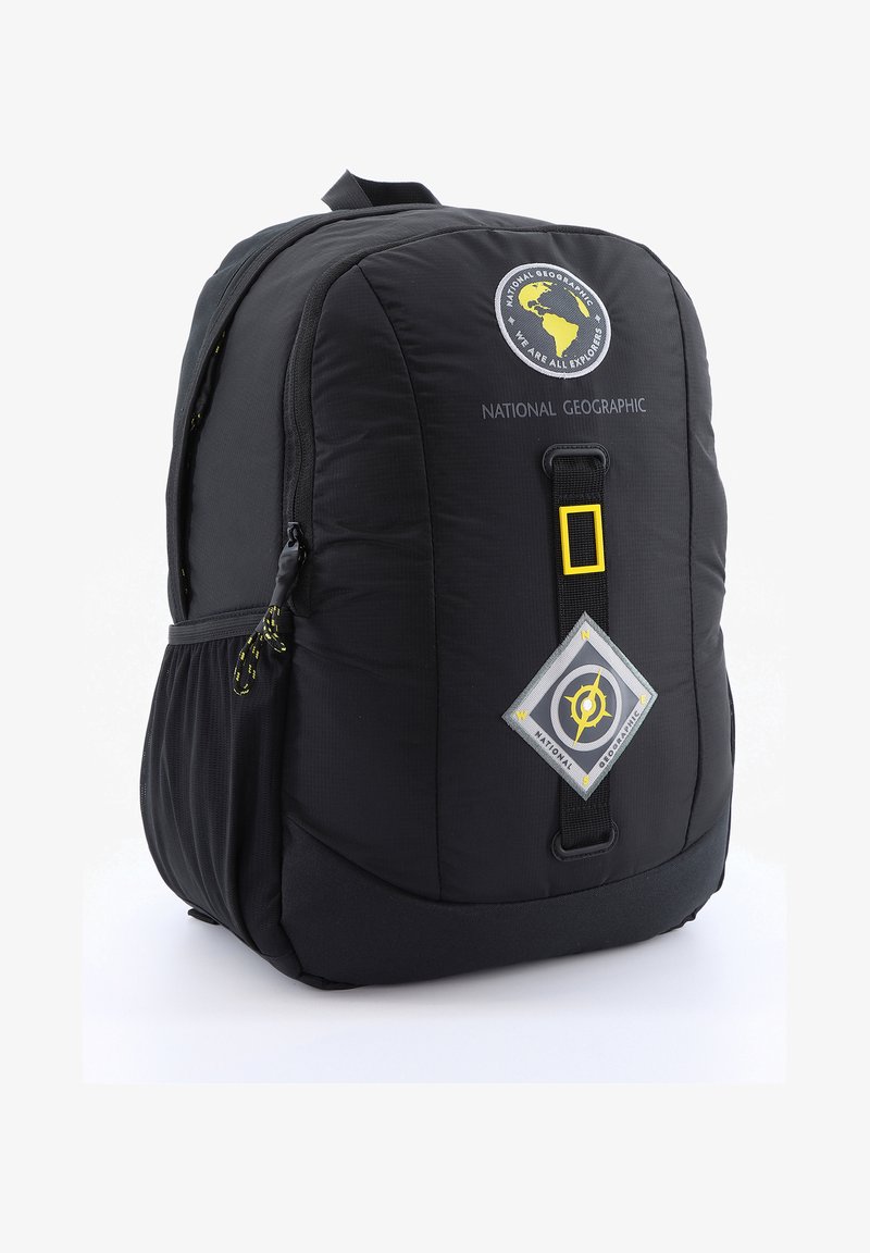 Black backpack with padded material, featuring a round National Geographic logo, yellow accents, and side mesh pockets for storage.