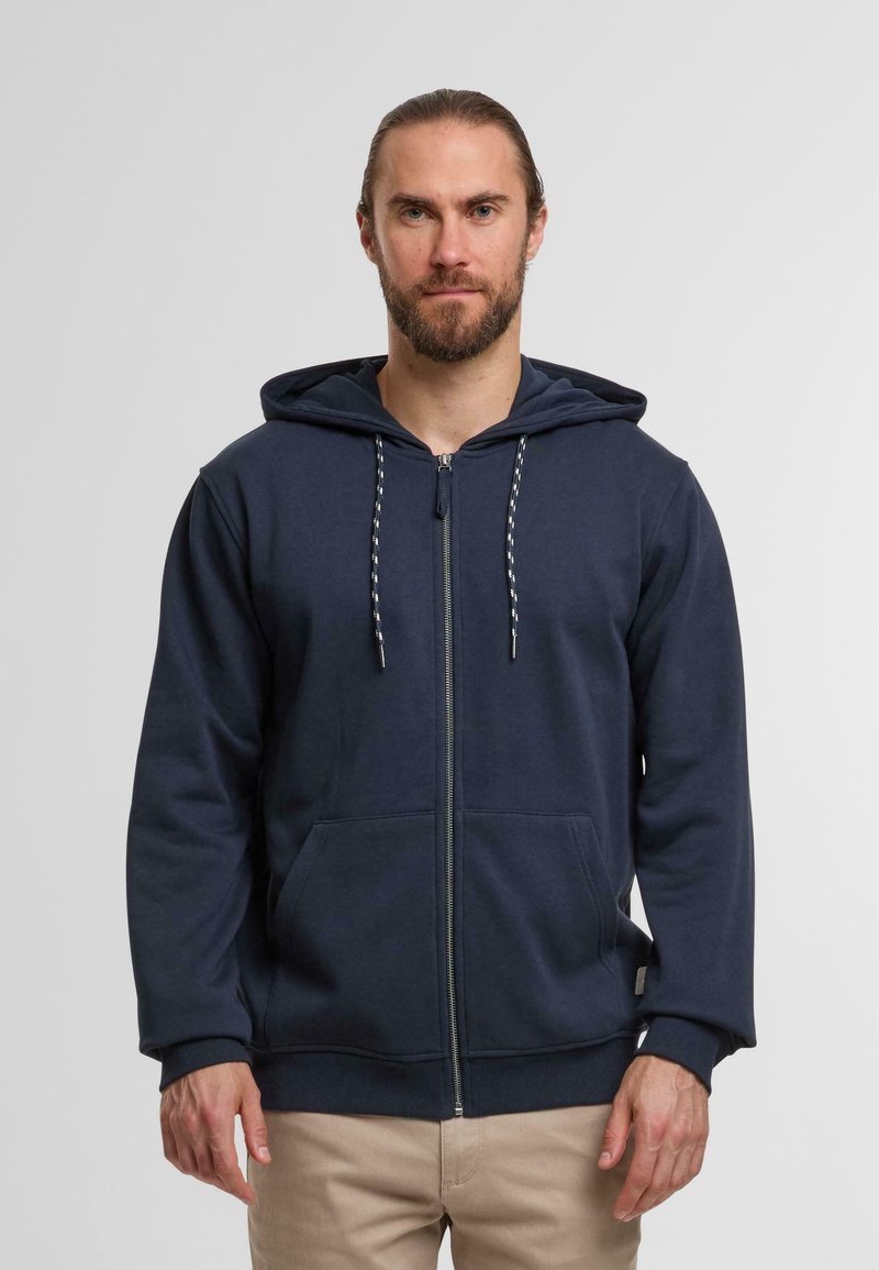 Navy zip-up hoodie with a drawstring hood, front pockets, and ribbed cuffs. Soft fabric with a smooth texture and no visible patterns.