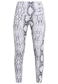 Smal passform leggings i ormskinnsmönster; tillverkade av mjukt, stretchigt tyg; pryds av vita, grå och svarta färger med diamantformer.