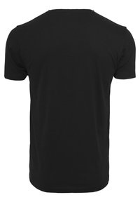 T-shirt en coton noir ; manches courtes, encolure ras du cou, coupe décontractée, texture lisse, uni sans motifs ni graphiques. Vue de dos affichée.