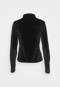 Trendyol Chaqueta de entrenamiento - black