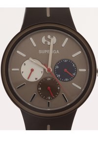 Round analog watch with a brown silicone strap. The face features grey and brown hues, three sub-dials, and silver and red accents.