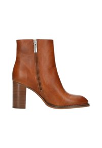 Bottines en cuir marron avec fermeture éclair sur le côté et talon bloc empilé, présentées en profil sur un fond blanc.