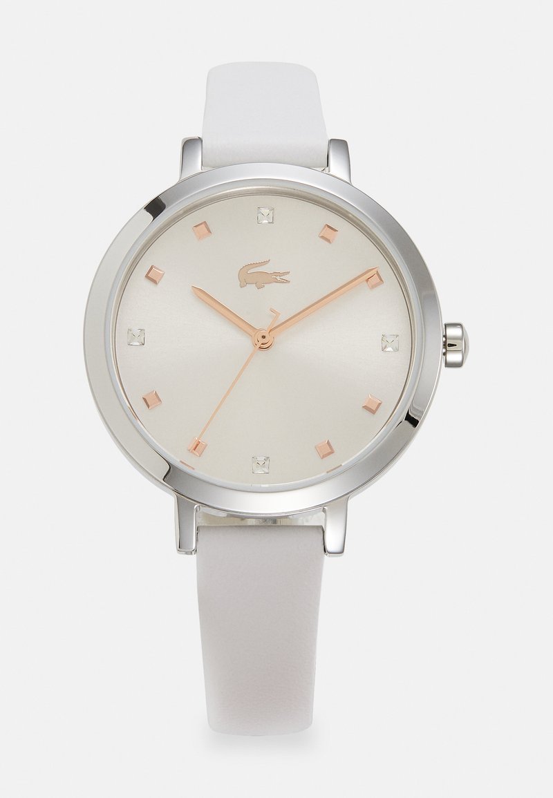 White leather strap watch with a round silver case, minimalist silver dial, rose gold hands, and square crystal hour markers.