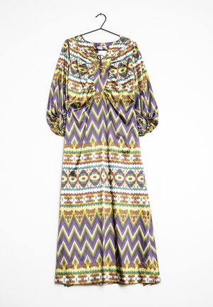 Long, patterned dress featuring geometric designs in green, purple, brown, and yellow. Soft fabric with a V-neck and puffed sleeves.