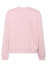 Roosa dressipluus, millel on ümar kaelus ja pikad varrukad, kaunistatud väikeste valgete südame mustritega. Pehme, tekstuurne kangas.