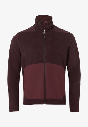Veste zippée bordeaux en tissu texturé, avec un panneau avant lisse et un col haut. Comprend un logo noir sur la poitrine.