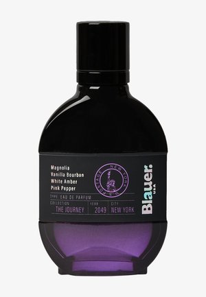 Eau de parfum bottle in black and purple. Round shape with a glossy finish. Text on the label includes fragrance notes and brand details.