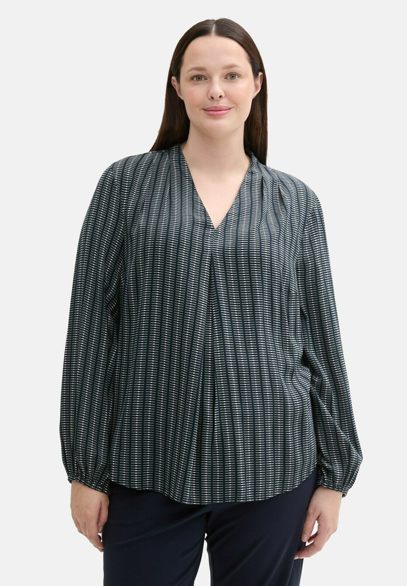 Bluză cu model închis, cu dungi verticale albe, decolteu în formă de V, mâneci lungi cu manșete pliate și croială lejeră.