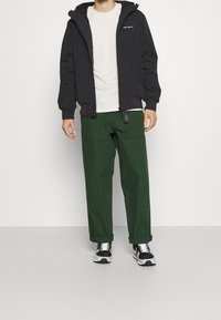 Carhartt WIP Mezisezónní bunda  - black