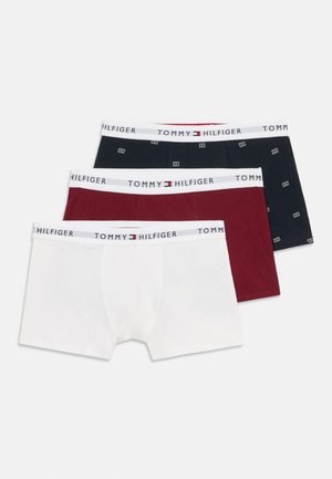 Three Tommy Hilfiger men's boxer briefs in white, burgundy, and navy blue with branded white waistbands.