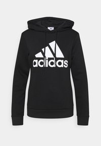 Felpa nera con cappuccio realizzata in tessuto morbido, caratterizzata da un grande logo Adidas bianco e tre strisce diagonali sul davanti; include un cappuccio con cordini.