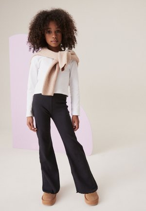 Next, RIB FLARE LEGGINGS.  - REGULAR FIT - Leggings - black