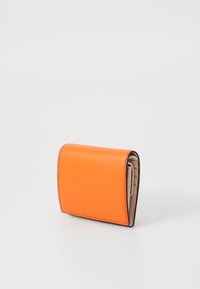 Orange leather wallet with textured finish, folded design, and contrasting neutral interior. Features visible stitching and slim profile.