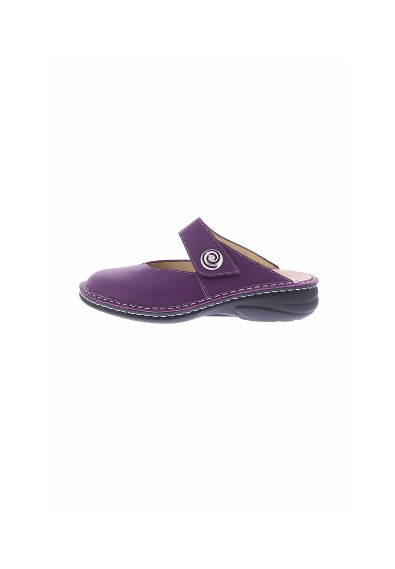 Purple slip-on shoe made of smooth material, featuring a rounded toe and adjustable strap with circular emblem, accented with white stitching.