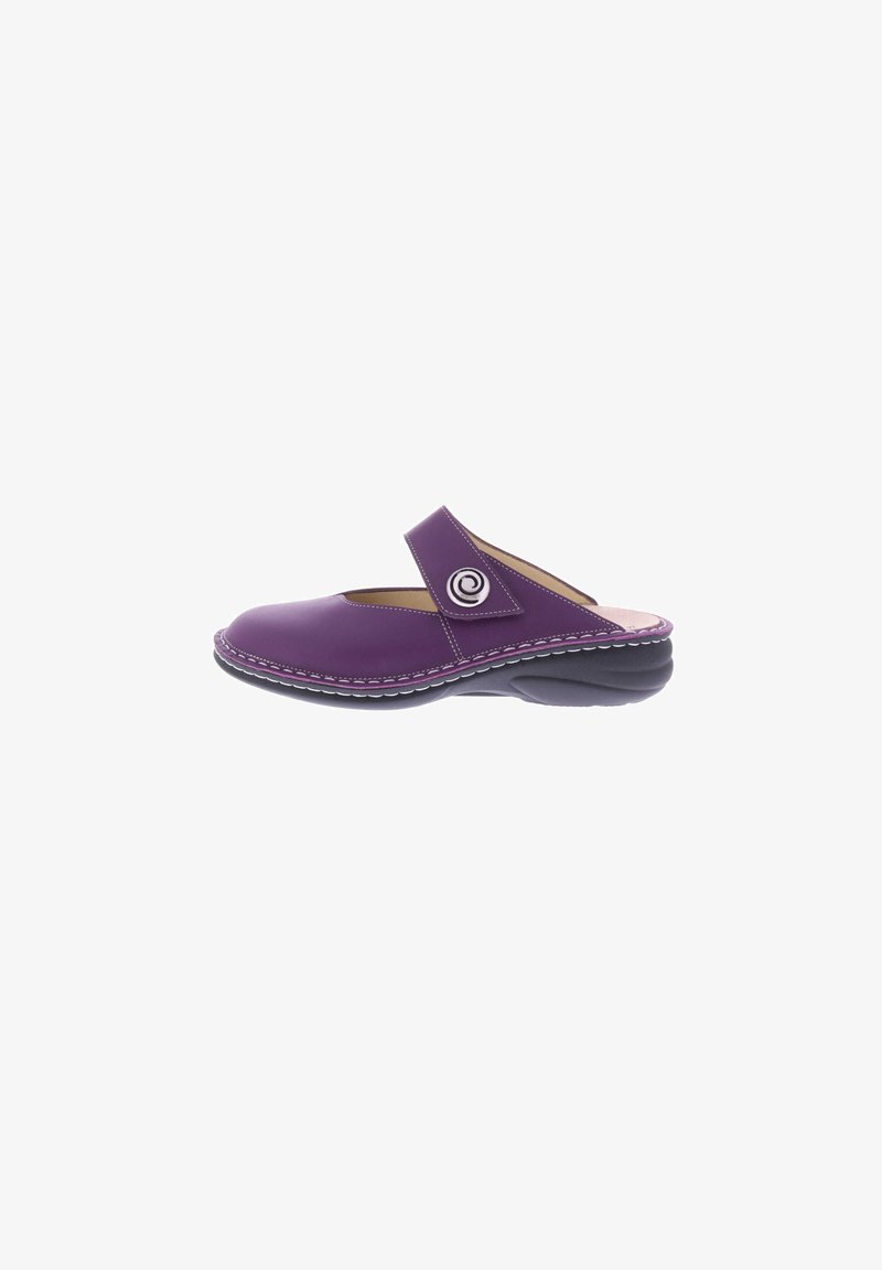 Purple slip-on shoe made of smooth material, featuring a rounded toe and adjustable strap with circular emblem, accented with white stitching.
