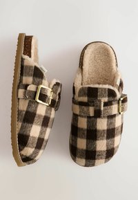 Brown and cream checkered slippers with soft, plush lining, a gold buckle accent, and a textured sole for grip. Designed for comfort.
