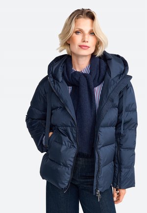 Dunkelblauer Steppjacke mit Kapuze und Reißverschluss vorne, vertikalen Nähten, elastischen Bündchen und Seitentaschen. Weicher Stoff und isoliertes Design.