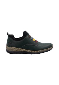 Chaussure décontractée à enfiler en vert foncé, avec des bandes élastiques multicolores, une semelle intermédiaire texturée couleur sable, une semelle noire et un col noir.